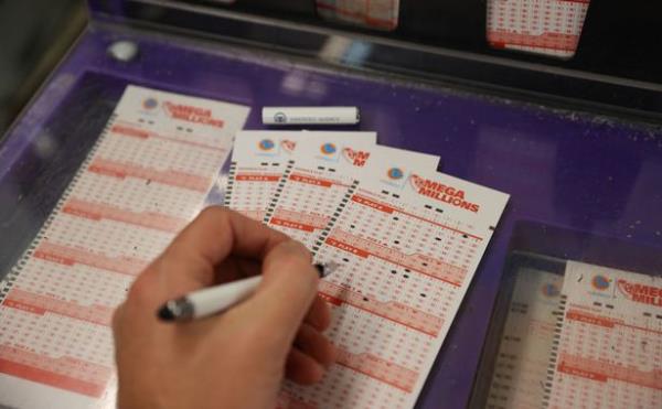 A person plays Mega Millions lottery at a store in San Mateo, California, United States on January 12, 2023