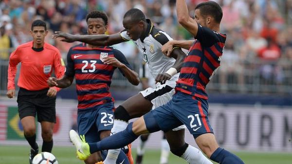 FILE - United States' Kellyn Acosta, left, and Matt Hedges, right, pressure Ghana's Raphael Dwamena, center, during the first half of an internatio<em></em>nal friendly soccer match at Pratt & Whitney Stadium at Rentschler Field, Saturday, July 1, 2017, in East Hartford, Conn. Former Ghana striker Raphael Dwamena has died after collapsing Saturday, Nov. 11, 2023, during an Albanian Super League soccer match. (AP Photo/Jessica Hill, FIle)