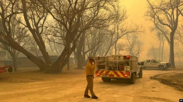 In this photo provided by the Flower Mound, Texas, Fire Department, Flower Mound firefighters respond to a fire in the Texas Panhandle, Feb. 27, 2024. (Flower Mound Fire Department via AP)