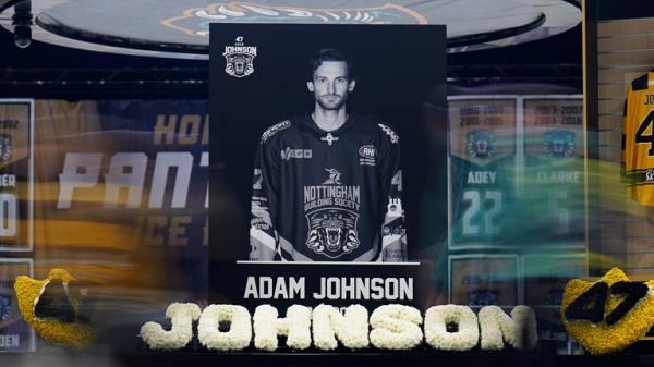 People queue to sign a book of co<em></em>ndolence as they attend a memorial for Nottingham Panthers' ice hockey player Adam Johnson at the Motorpoint Arena, Nottingham
