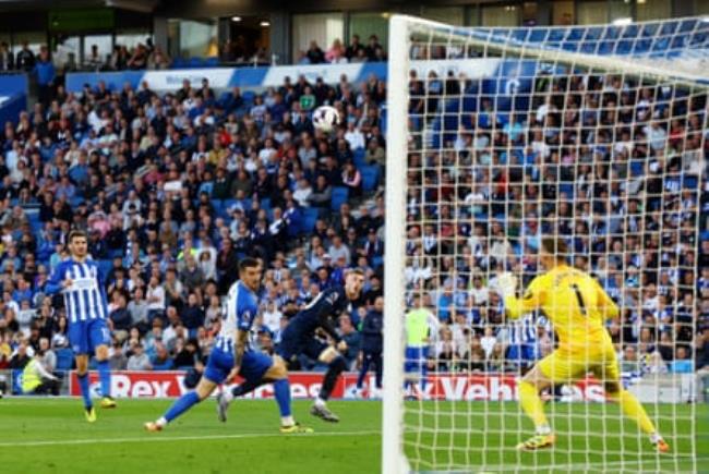 Chelsea’s Cole Palmer scores their first goal past Brighton & Hove Albion’s keeper Bart Verbruggen.