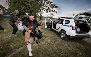 Olena, 51, is evacuated from her home in Vovchansk