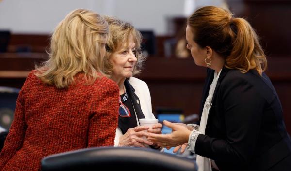 From left, N.C. Senators Lisa Barnes, Joyce Krawiec and Vickie Sawyer co<em></em>nfer before the start of the afternoon session at the N.C. Legislature in Raleigh, N.C. Thursday, May 4, 2023.