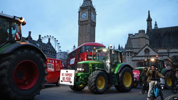 Farmers drive tractors around Parliament Square during a demo<em></em>nstration organized by Save British Farming against UK food policy, substandard im<em></em>ports and food labeling regulations, in London, March 25, 2024.
