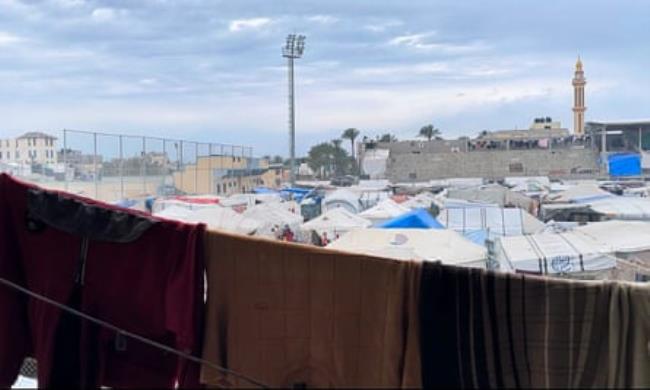Tents on the pitch of the Al-Dorra Stadium in Deir al-Balah