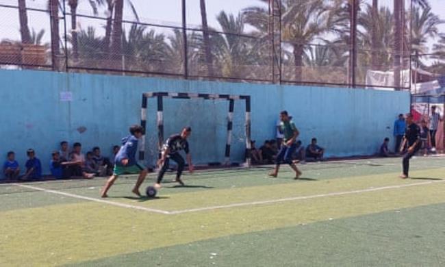 Mohammed Abu-Hujair takes on the goalkeeper in a five-a-side match at Al-Salah FC in Deir al-Balah