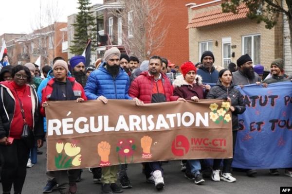 Protestors call on the Canadian government to regularize unnew<em></em>lineed migrants in Montreal, Quebec, on March 16, 2024.