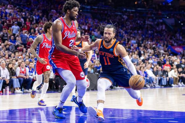 Jalen Brunson drives to the rim against Joel Embiid during the Knicks' Game 4 win over the 76ers on April 28, 2024.