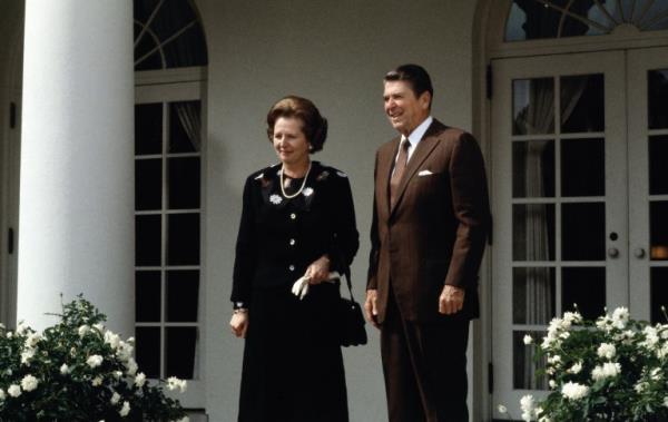 British Prime Minister Margaret Thatcher waves to a crowd of o<em></em>nlookers as she stands in the open door of a car during a State Visit to the Soviet Unio<em></em>n, Moscow, Russia, March 29, 1987. (Photo by Derek Hudson/Getty Images)