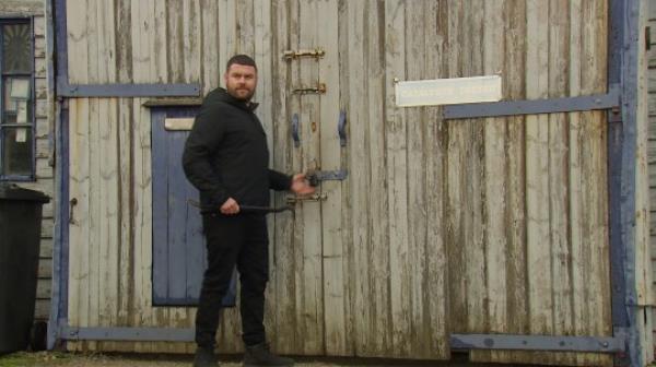 Aaron at the garage in Emmerdale