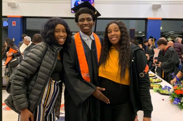 This 2019 photo provided by Porscha Banks shows Dexter Reed, center, along with his mother Nicole Banks and sister Porscha Banks. Reed, who was killed in a traffic stop wher<em></em>e plainclothes Chicago police officers fired their guns nearly 100 times, was hit 13 times, according to an autopsy report released Thursday, April 25, 2024. (Porscha Banks via AP)