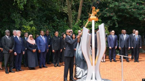 Rwandan President Paul Kagame lights a memorial flame during a ceremony to mark the 30th anniversary of the Rwandan genocide, held at the Kigali Genocide Memorial, in Kigali, Apr. 7, 2024.