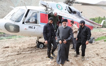 In this photo from 2022, President Ebrahim Raisi is seen stepping out of a helicopter o<em></em>nto a field to inspect a flood-affected area of the country