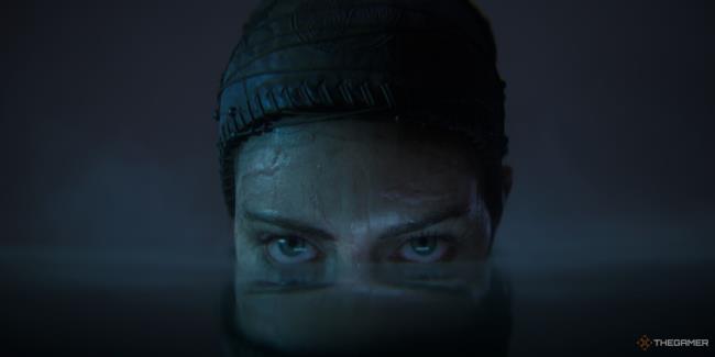 Senua's face half-submerged in water in Hellblade 2