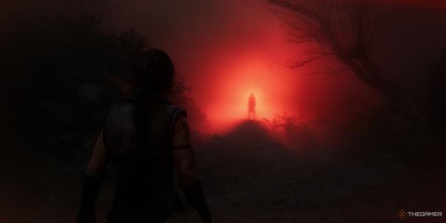 zynbel appears in a harsh red light in senua's saga: hellblade 2