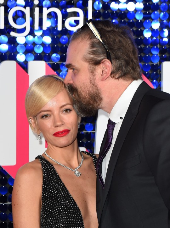 David Harbour kisses his wife, Lily Allen on the red carpet