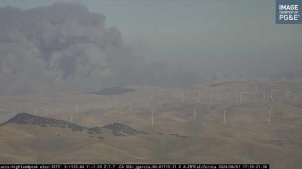 In this image from an ///con<em></em>firm/i/i/iCalifornia/UC San Diego mo<em></em>nitoring camera, smoke rises from the Corral Fire near the city of Tracy, Calif., Saturday, June 1, 2024. (///con<em></em>firm/i/i/iCalifornia/UC San Diego via AP)