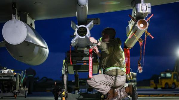 RAF Weapon Technicians prepare RAF Typhoon FRG4 aircraft to co<em></em>nduct further strikes against Houthi military targets in Yemen, from RAF Akrotiri, Cyprus, Saturday, Feb. 3, 2024. (Cpl Samantha Drummee/Ministry of Defence via AP)