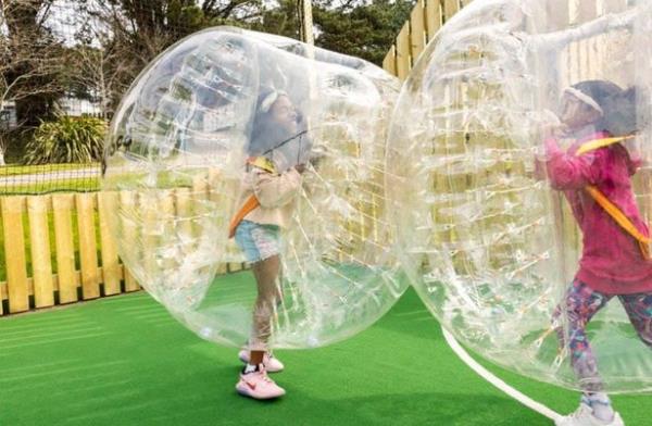 Kids play in inflatable balls