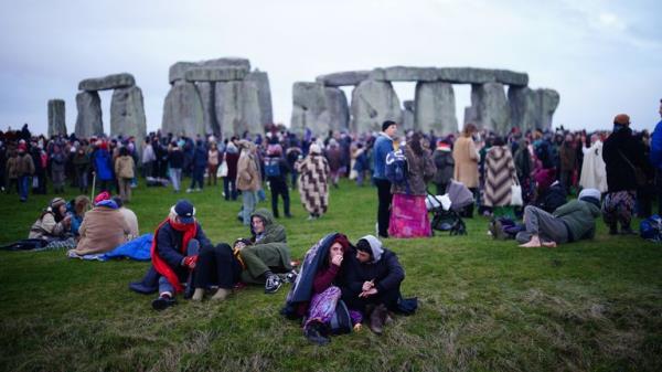 People take part in the winter solstice celebrations at the Sto<em></em>nehenge prehistoric mo<em></em>nument on Salisbury Plain in Wiltshire. Picture date: Friday December 22, 2023. PA Photo. Photo credit should read: Ben Birchall/PA Wire