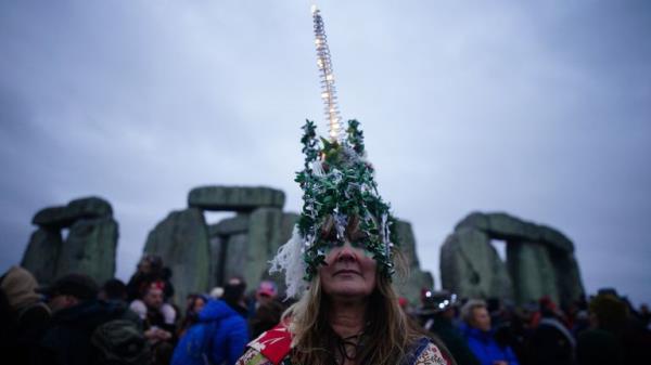 People take part in the winter solstice celebrations at the Sto<em></em>nehenge prehistoric mo<em></em>nument on Salisbury Plain in Wiltshire. Picture date: Friday December 22, 2023. PA Photo. Photo credit should read: Ben Birchall/PA Wire