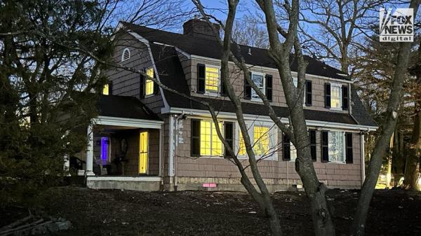 An exterior view of the front entrance of Joseph and Susana Landa’s home wher<em></em>e squatter Brett Flores has taken over.