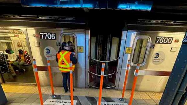 rubber poles around no standing zone on subway platform
