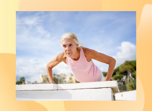 mature blo<em></em>nde woman doing pushups outdoors on a sunny day