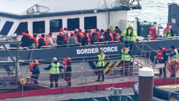 A group of people thought to be migrants are brought to Dover o<em></em>nboard a Border Force vessel. Pic: PA