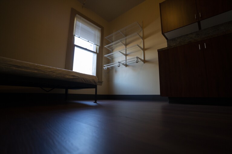 An empty bedroom is seen in an affordable housing building run by Central City Concern, a Portland-ba<em></em>sed homeless services nonprofit, on Friday, March 15, 2024, in Portland, Ore. The no<em></em>nprofit leases more than 1,000 single room occupancy units, both subsidized and not, to people who are co<em></em>nsidered extremely low-income. It helps people struggling to access housing due to things like eviction histories and poor credit scores. (AP Photo/Jenny Kane)
