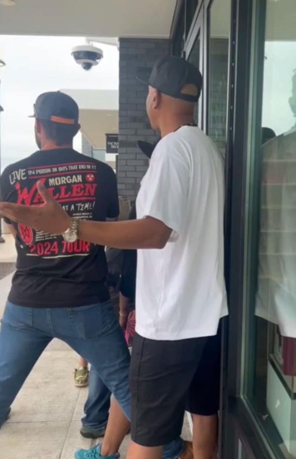 The shoppers were outside the store and held the front door closed, trapping the suspects inside.