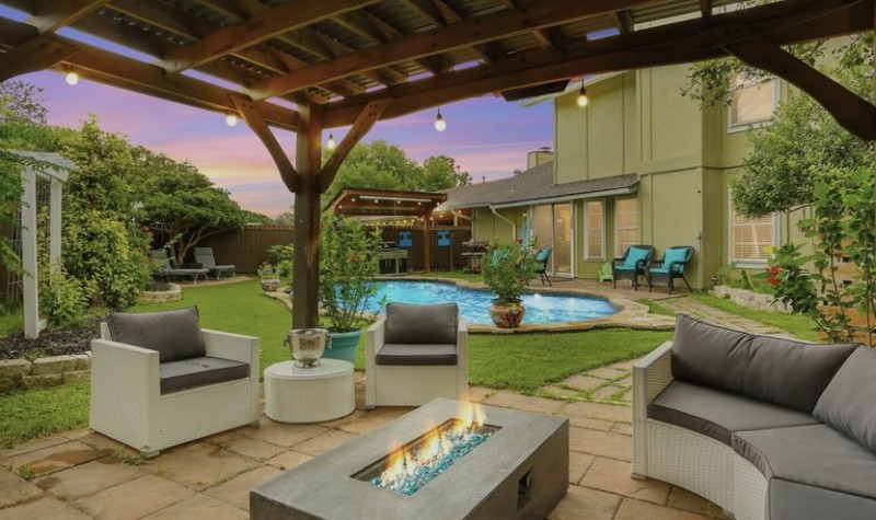 San Antonio, TX home with pool and firepit in foreground