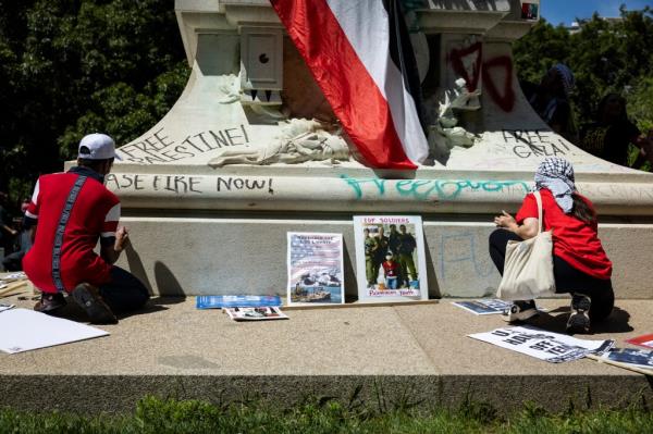 Pro-Palestinian activists write graffiti messages on the Rochambeau Statue in Lafayette Park next to the White House during a demo<em></em>nstration protesting the war in Gaza on June 8, 2024 in Washington, DC. 