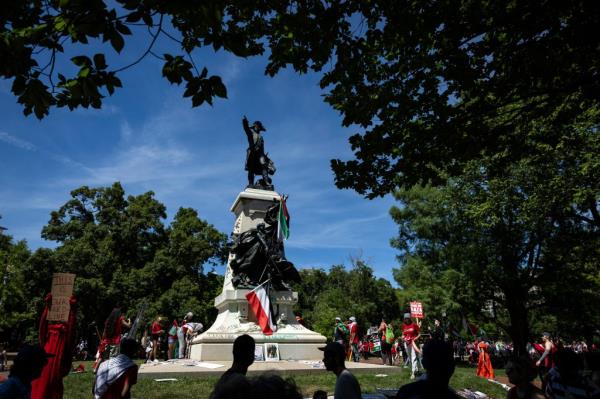 Pro-Palestinian activists leave Palestinian flags and graffiti on the Rochambeau Statue in Lafayette Park next to the White House during a demo<em></em>nstration protesting the war in Gaza on June 8, 2024 in Washington, DC.