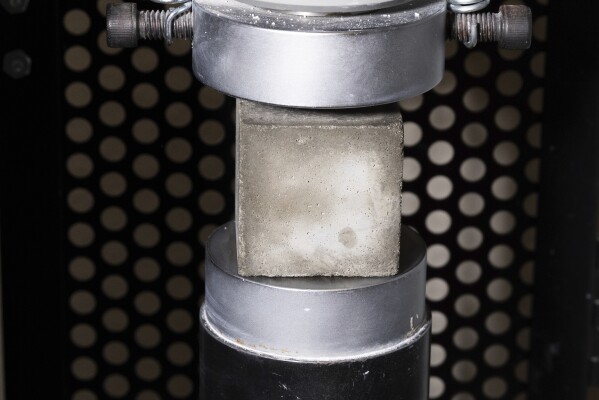 A mortar cube is tested for compressive strength in the product lab at Fortera's facility in San Jose, Calif., Wednesday, April 10, 2024. The cement industry is one of the largest emitters of carbon dioxide and is respo<em></em>nsible for a<em></em>bout 8% of global emissions each year. Fortera, a clean tech company whose technology captures carbon emissions from kilns and feeds it back in to the process, is opening its first commercial scale operation on Thursday, April 12, 2024, in California. (AP Photo/Benjamin Fanjoy)