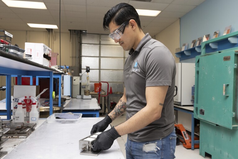 Jesus Go<em></em>nzalez Pequeno works in the product lab at Fortera's facility in San Jose, Calif., Wednesday, April 10, 2024. The cement industry is one of the largest emitters of carbon dioxide and is respo<em></em>nsible for a<em></em>bout 8% of global emissions each year. Fortera, a clean tech company whose technology captures carbon emissions from kilns and feeds it back in to the process, is opening its first commercial scale operation on Thursday, April 12, 2024, in California. (AP Photo/Benjamin Fanjoy)