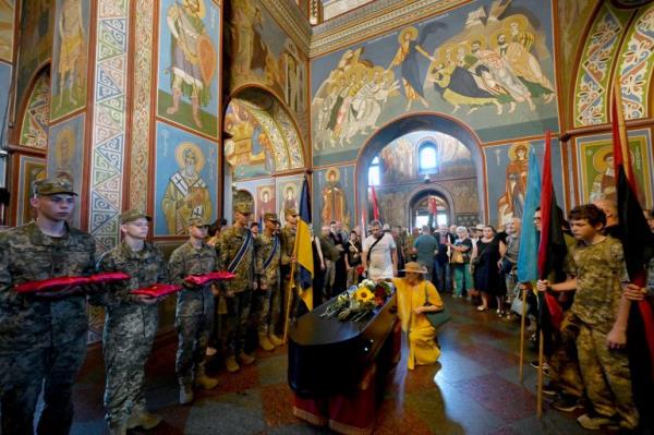 Servicemen hold the decorations of Ukraine activist and serviceman Mykola Kokhanivsky who was killed in battle near Kharkiv