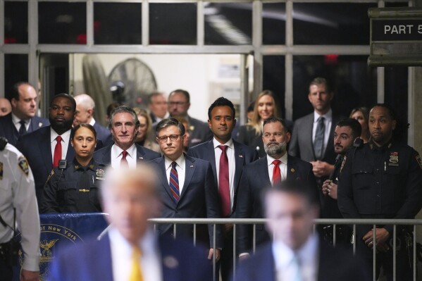 From left North Dakota Gov. Doug Burgum, U.S. Speaker of the House Mike Johnson and businessman Vivek Ramaswamy look on as former President Do<em></em>nald Trump talks to the media as he arrives at Manhattan criminal court in New York, on May 14, 2024. (Curtis Means/Pool Photo via AP)