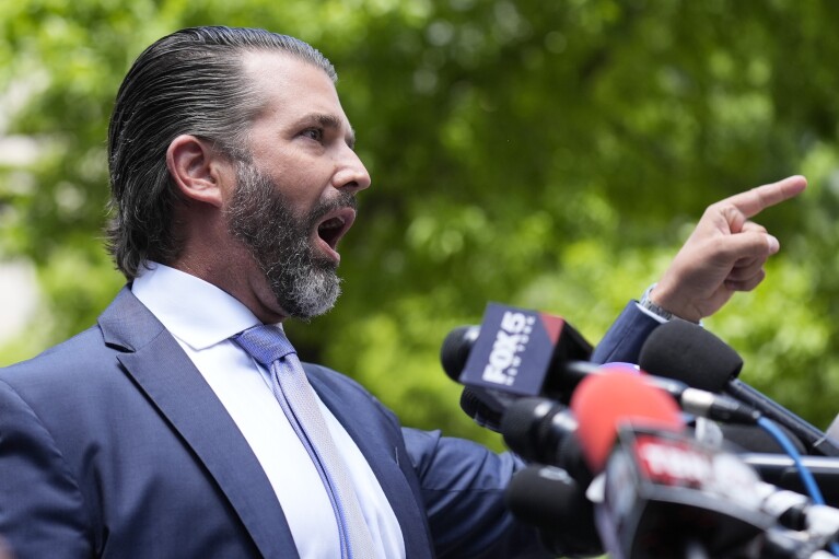 Do<em></em>nald Trump, Jr. speaks to reporters across the street from former President Do<em></em>nald Trump's criminal trial in New York, on May 28, 2024. (AP Photo/Seth Wenig)
