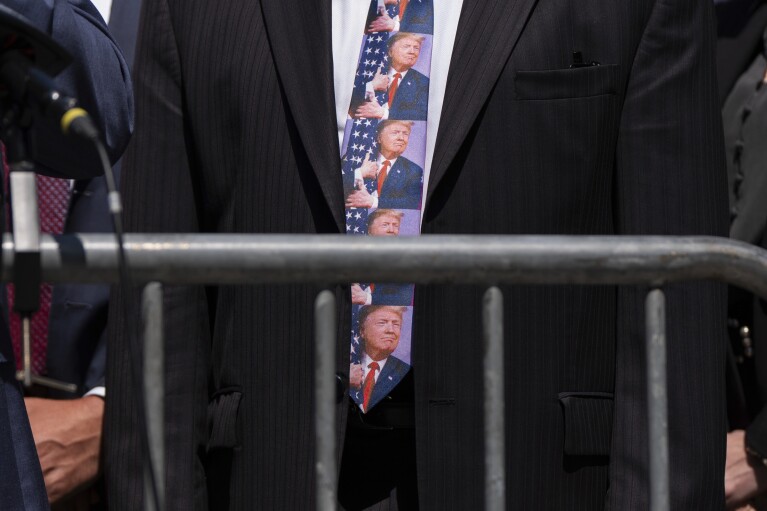 Rep. Troy Nehls, R-Texas, wears a tie with photographs of former President Do<em></em>nald Trump during a press co<em></em>nference outside Manhattan criminal court, on May 21, 2024, in New York. (AP Photo/Julia Nikhinson)