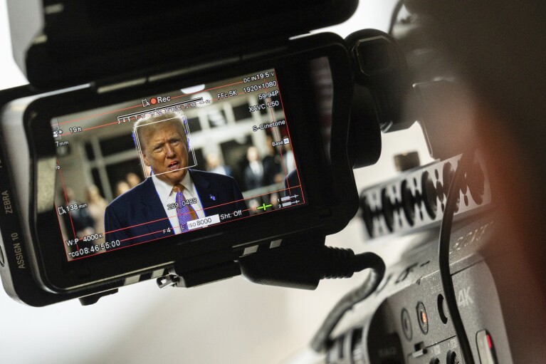 Former President Do<em></em>nald Trump, seen through a camera viewfinder, speaks to members of the media at Manhattan criminal court in New York, on May 2, 2024. (Jeenah Moon/Pool Photo via AP)