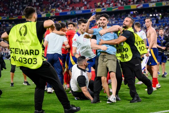 The security guard was attempting to intercept a pitch invader