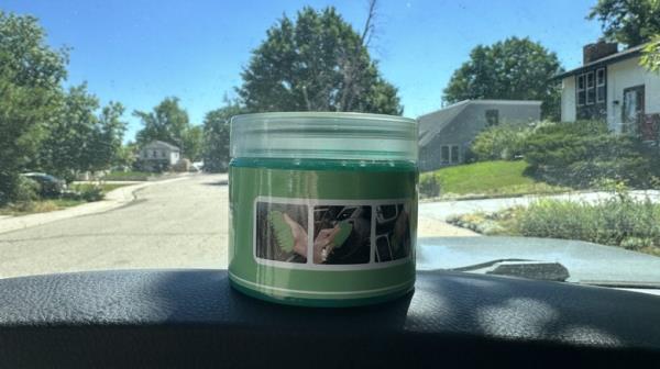 Dust cleaning gel in co<em></em>ntainer sitting on dash