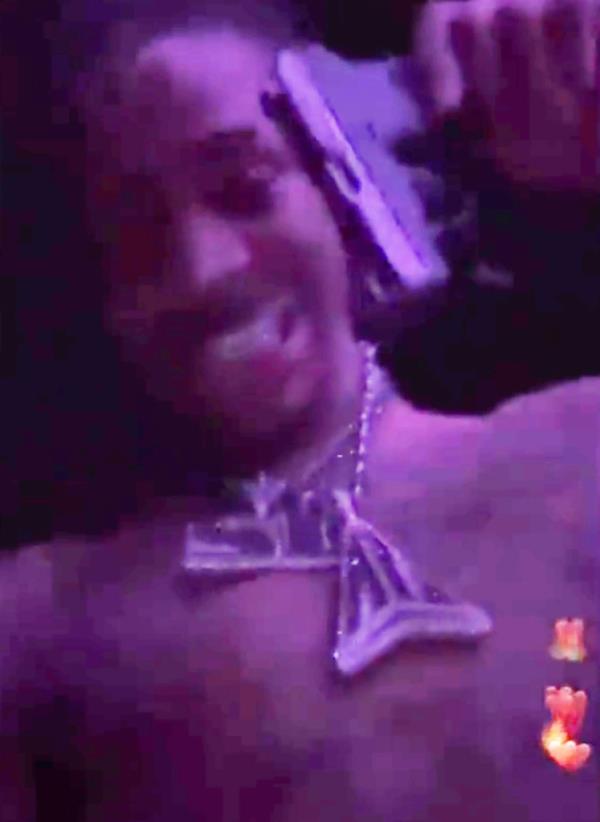 Ja Morant holding a gun in an Instagram Live video at a strip club on March 4, 2023.