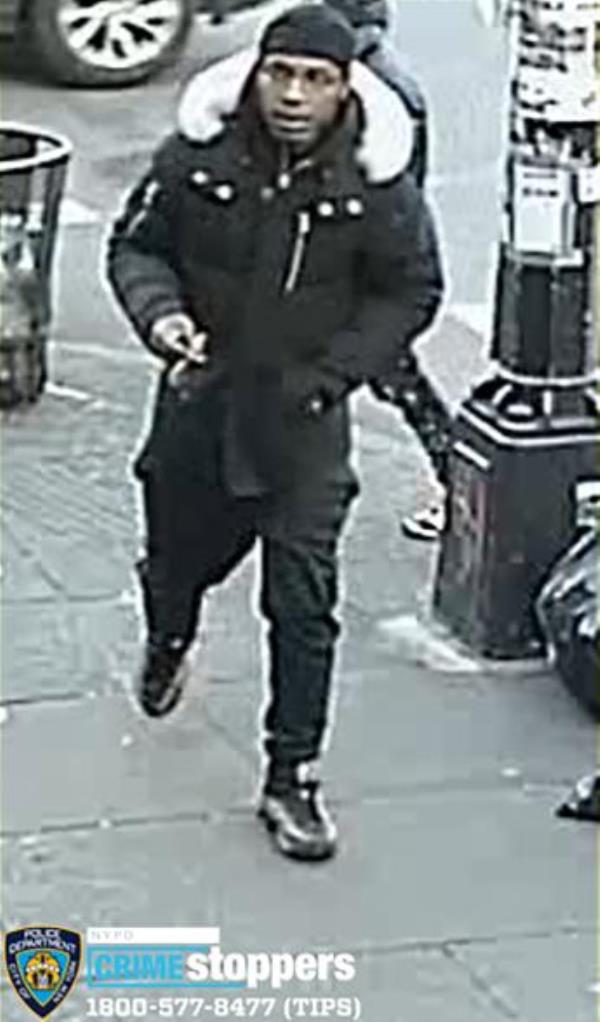 Footage of the second suspect wearing black