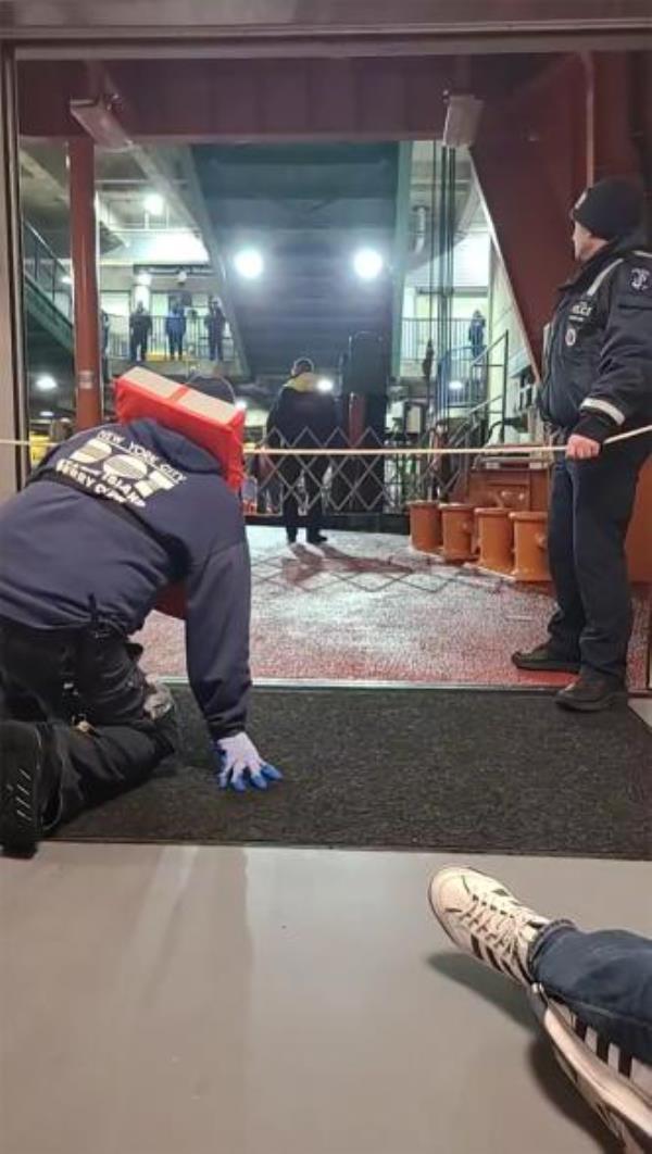 Emergency Service police officers are seen arriving in the Staten Island Ferry Terminal as the Sandy Ground ferry boat which had an engine fire was pushed into the terminal .