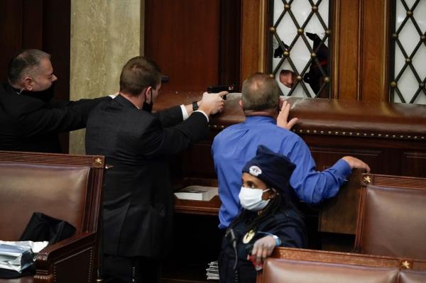 Rioters battled police officers and broke into the Senate chamber on Jan. 6, 2021.