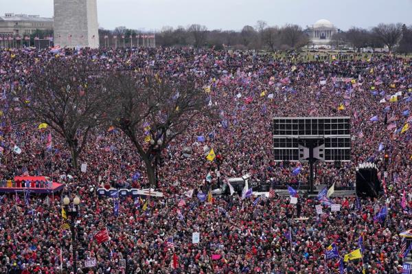 With the Washington Mo<em></em>nument in the background, people attend a rally in support of President Do<em></em>nald Trump near the White House on Wednesday, Jan. 6, 2021, in Washington.