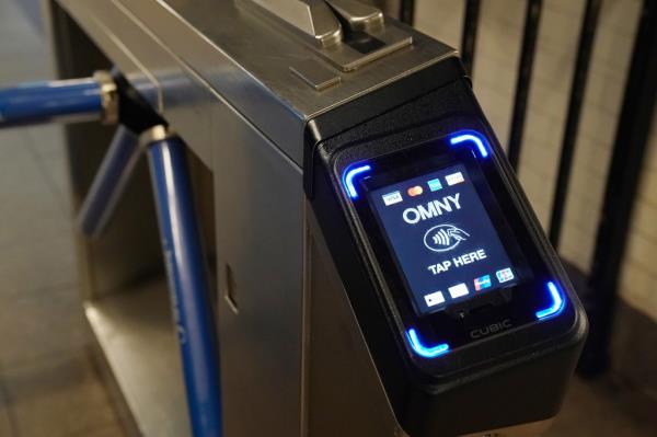 an OMNY fare reader on a turnstile