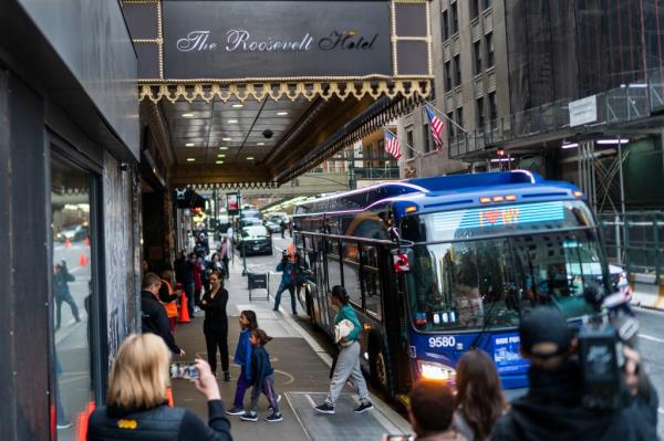 Migrants arrived at the Roosevelt Hotel on Friday morning.